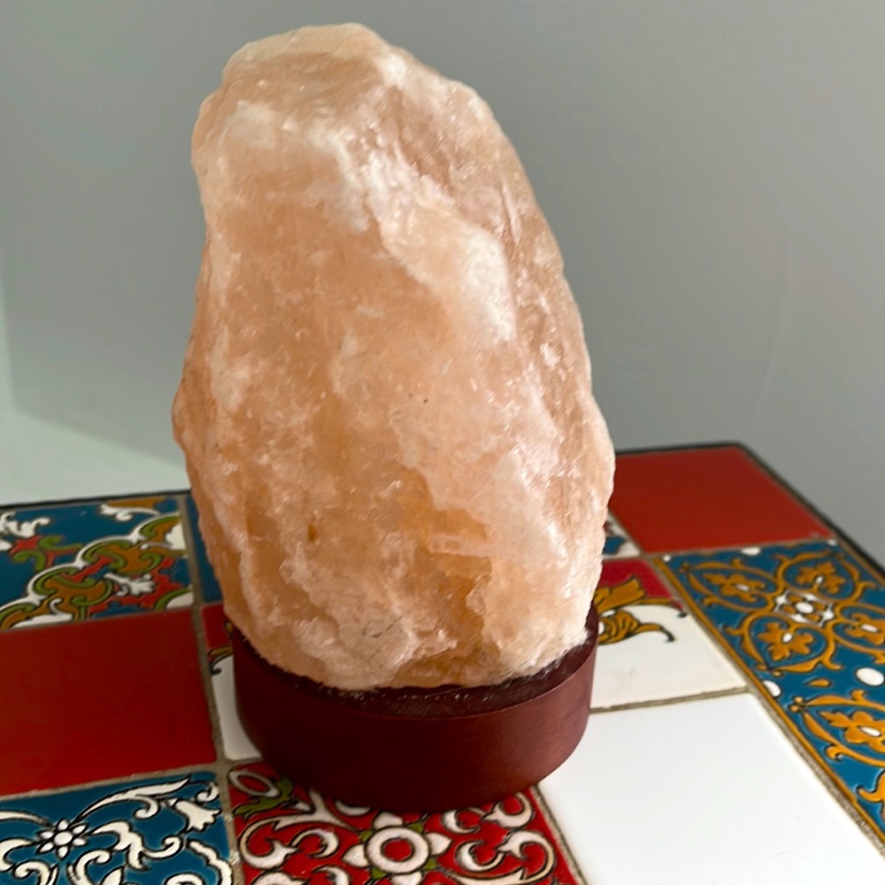 Electric Himalayan salt glow lamp. Sits 8 inches high on wooden base.